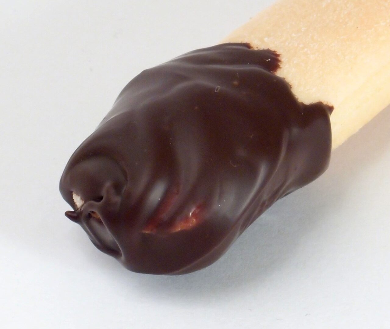 A glossy, properly tempered dark couverture chocolate sample